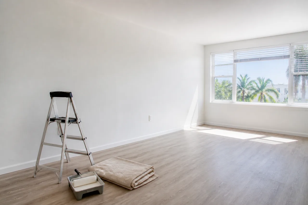A freshly painted empty apartment living room during turnover.