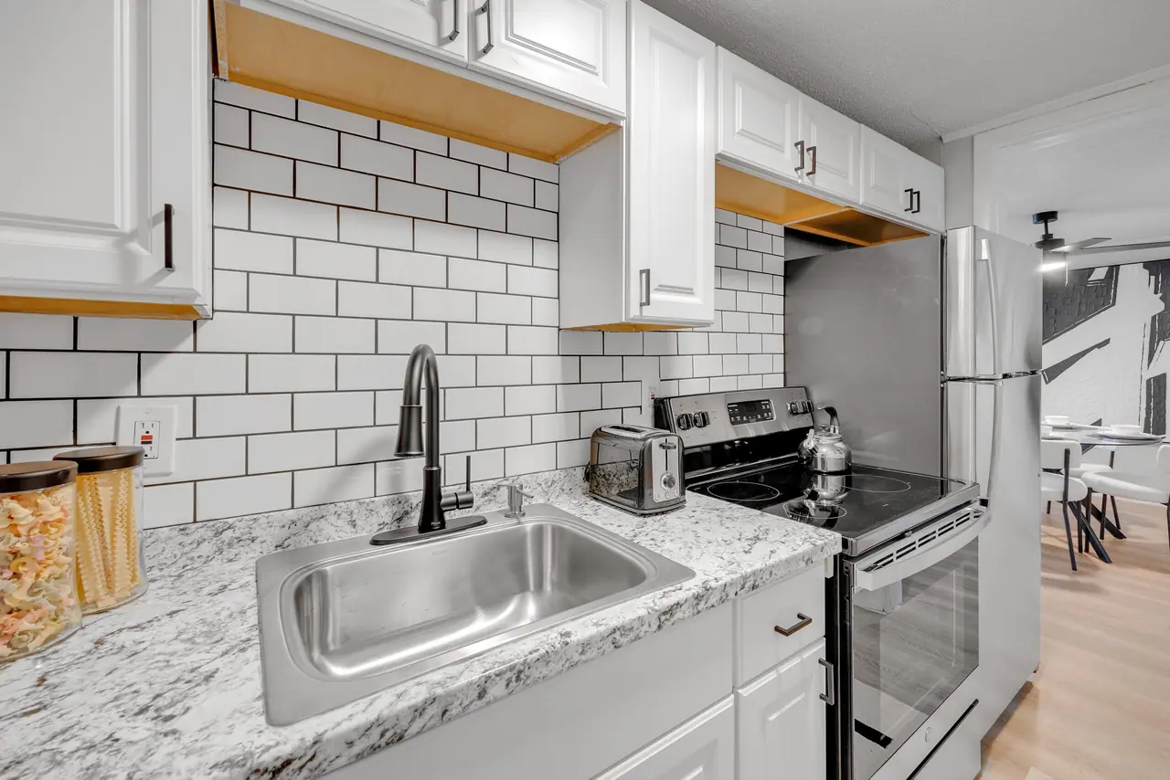 A renovated apartment kitchen at Jax Bay in Jacksonville, Florida.
