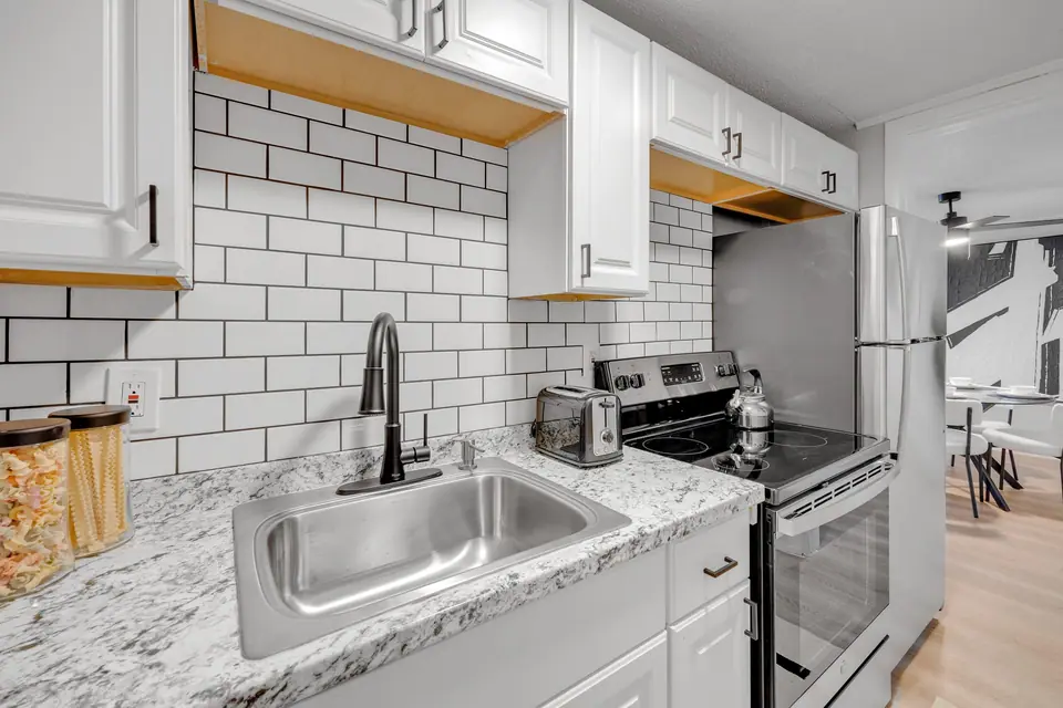 A renovated apartment kitchen at Jax Bay in Jacksonville, Florida.