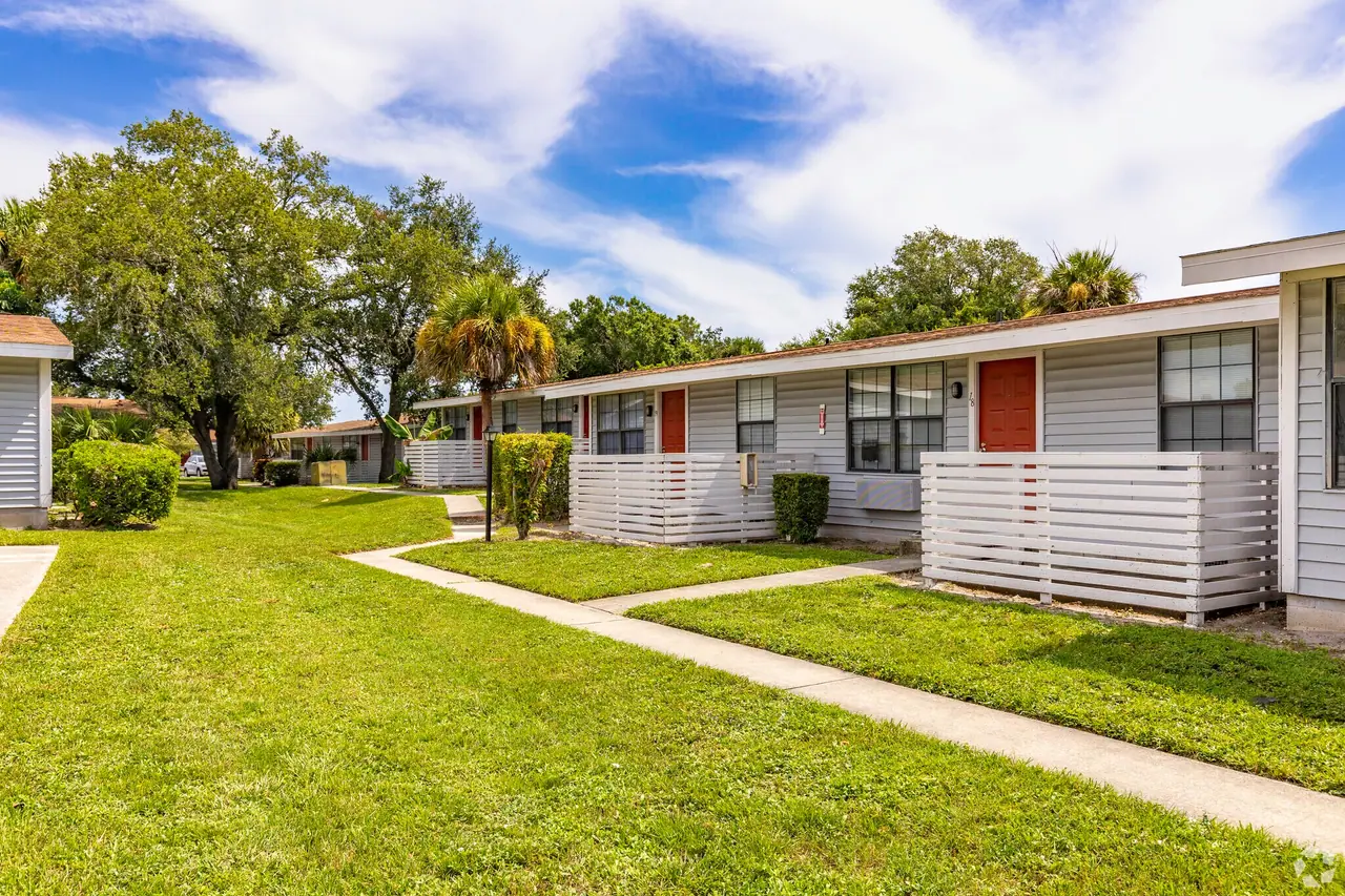 Patio-lined apartment homes at Palm Harbor Villas in Melbourne, Florida.