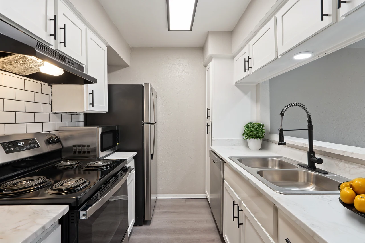 An updated apartment kitchen at Regal Court in Dallas, Texas.
