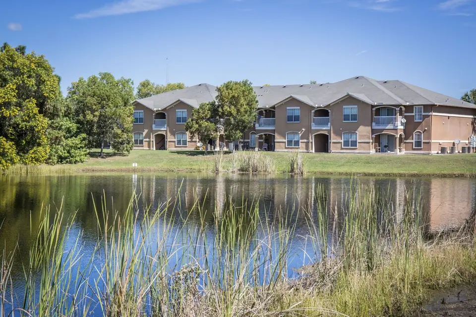 Apartment homes beside the lake at Sanctuary at Winterlakes in Port St. Lucie, Florida.