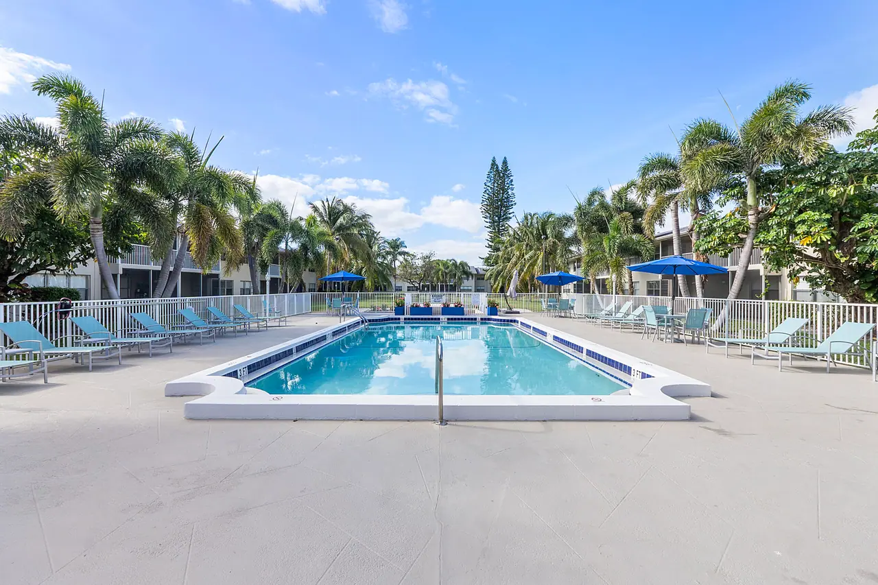 The pool and palm-lined deck at Waterford Bay in Boca Raton, Florida.